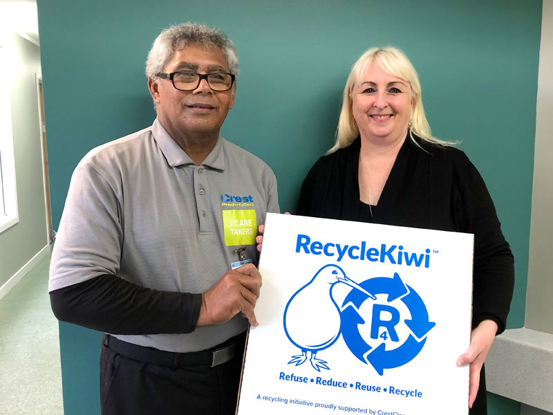 Principal Janet Moyle with caretaker Tagau Meleson seen presenting a RecycleKiwi resource pack.