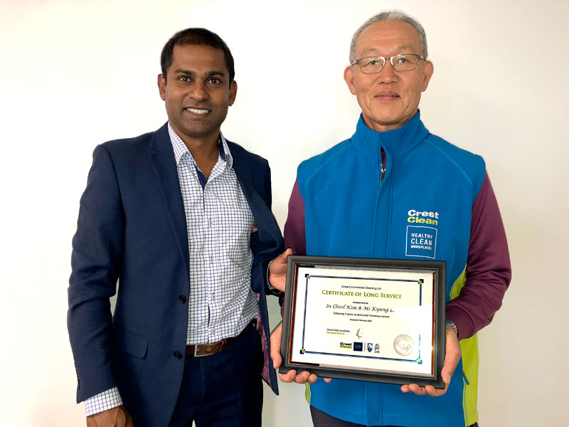 David Kim receives his long service award from Yasa Panagoda, CrestClean’s Christchurch North Regional Manager.