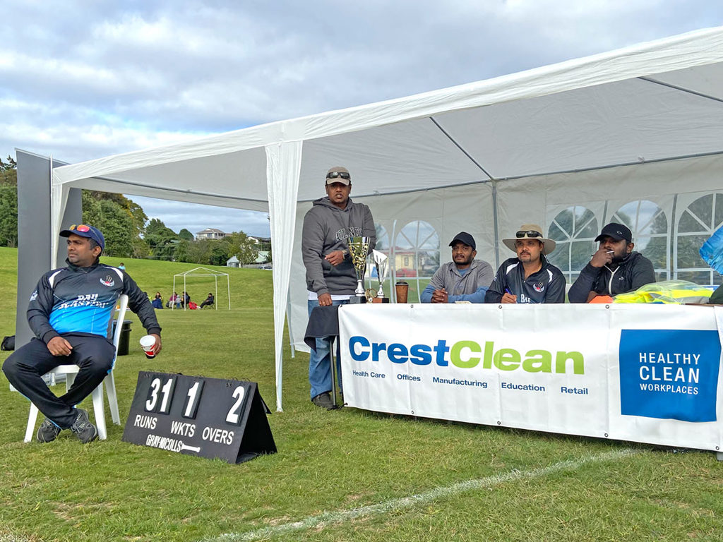 Score keepers at a cricket game.