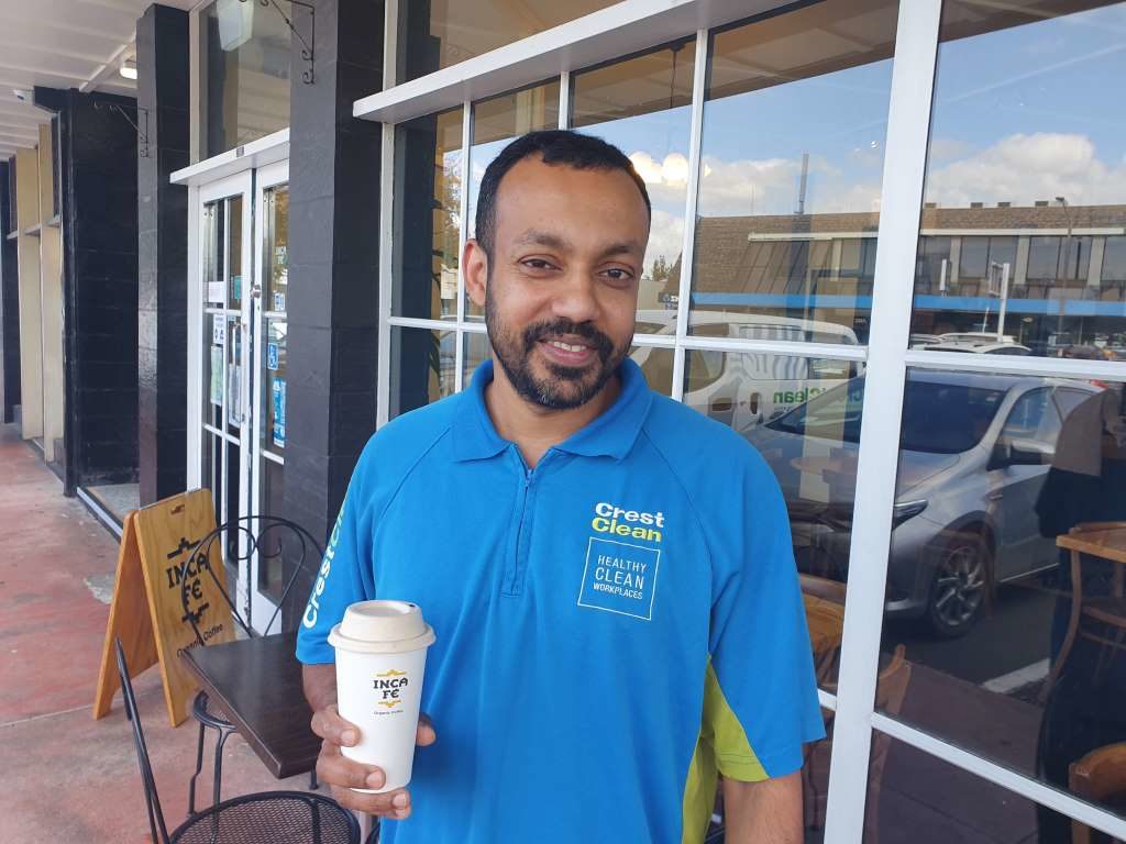 Man holding cup of tea.