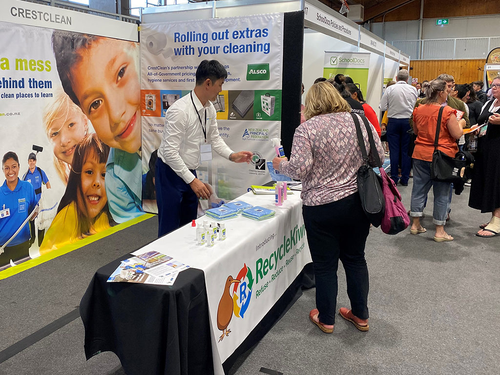 Cleaning stand at education conference.