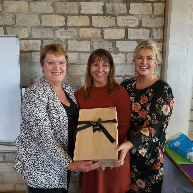 Teachers are presented with prize hamper.